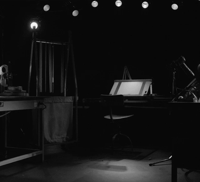 B&W dark-studio / gear still